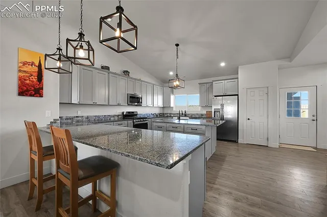 a bedroom with a bed and a book shelf