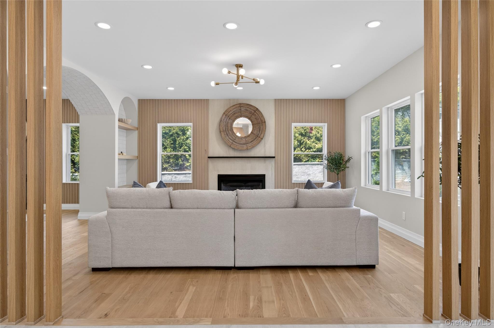 15 Ridge Drive Port Washington, NY 11050 - Photo 16 of 46 a living room with furniture and a fireplace