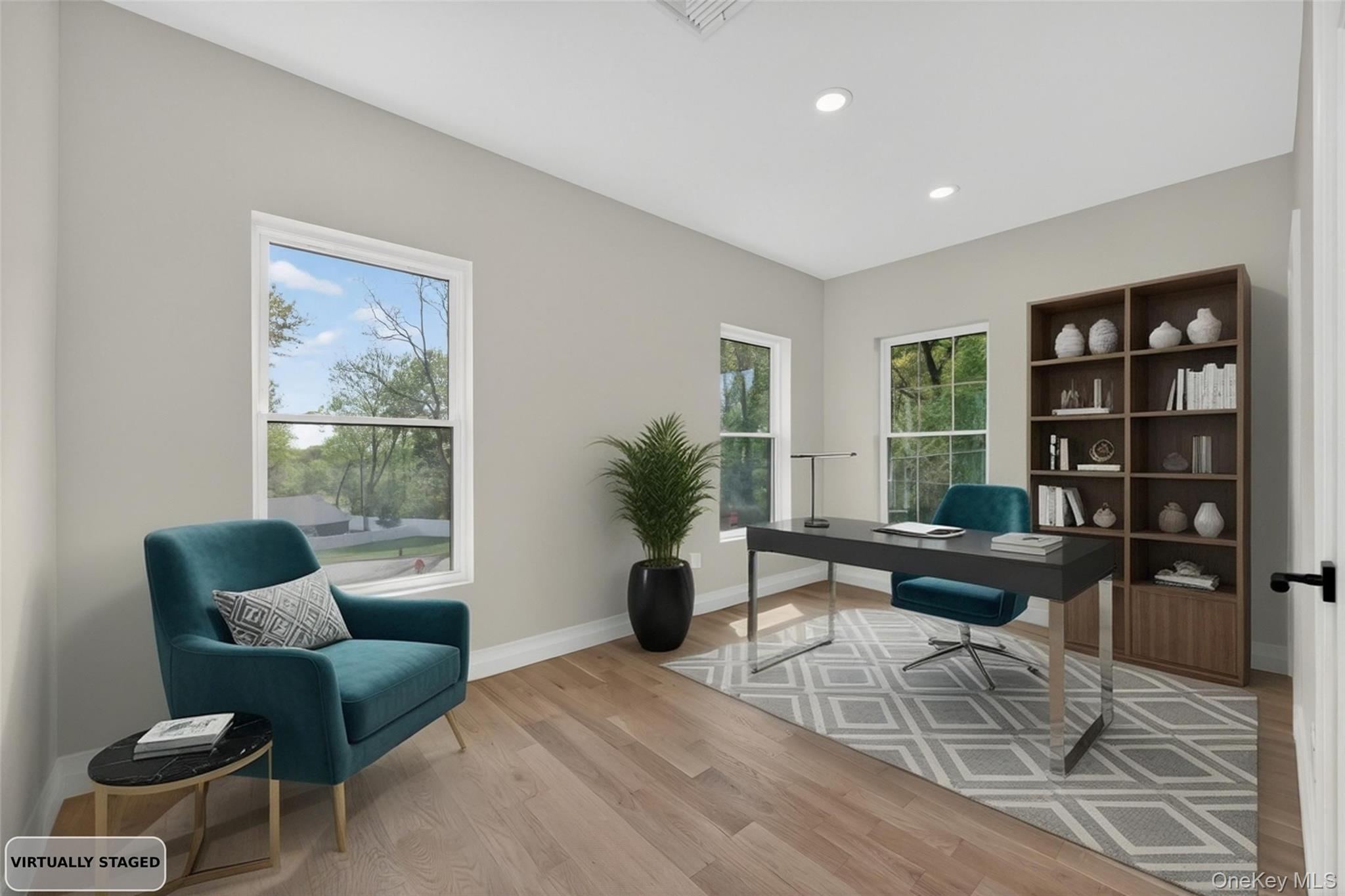15 Ridge Drive Port Washington, NY 11050 - Photo 20 of 46 a living room with furniture and a potted plant next to a window