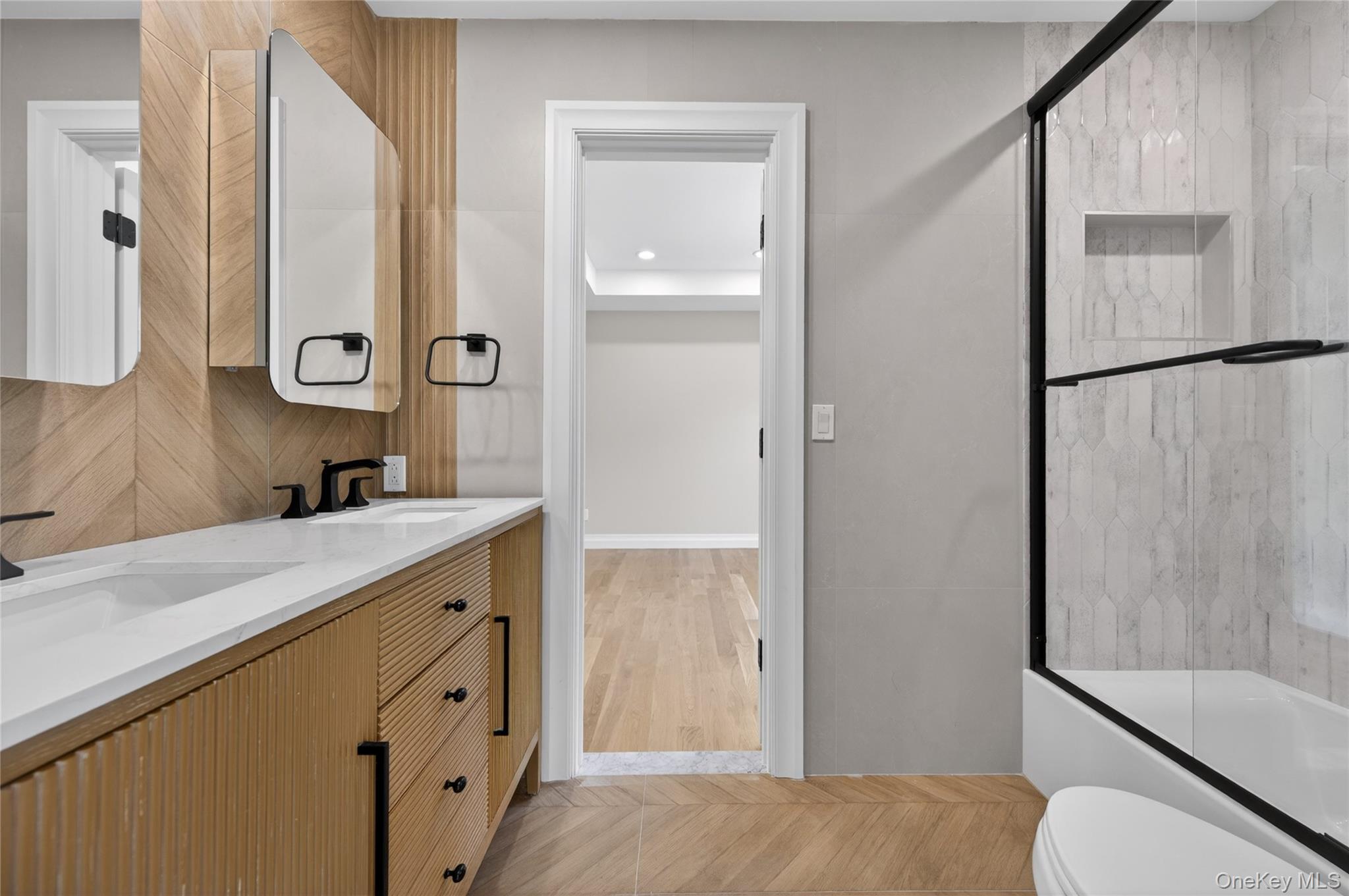 15 Ridge Drive Port Washington, NY 11050 - Photo 21 of 46 a bathroom with a granite countertop sink toilet and shower