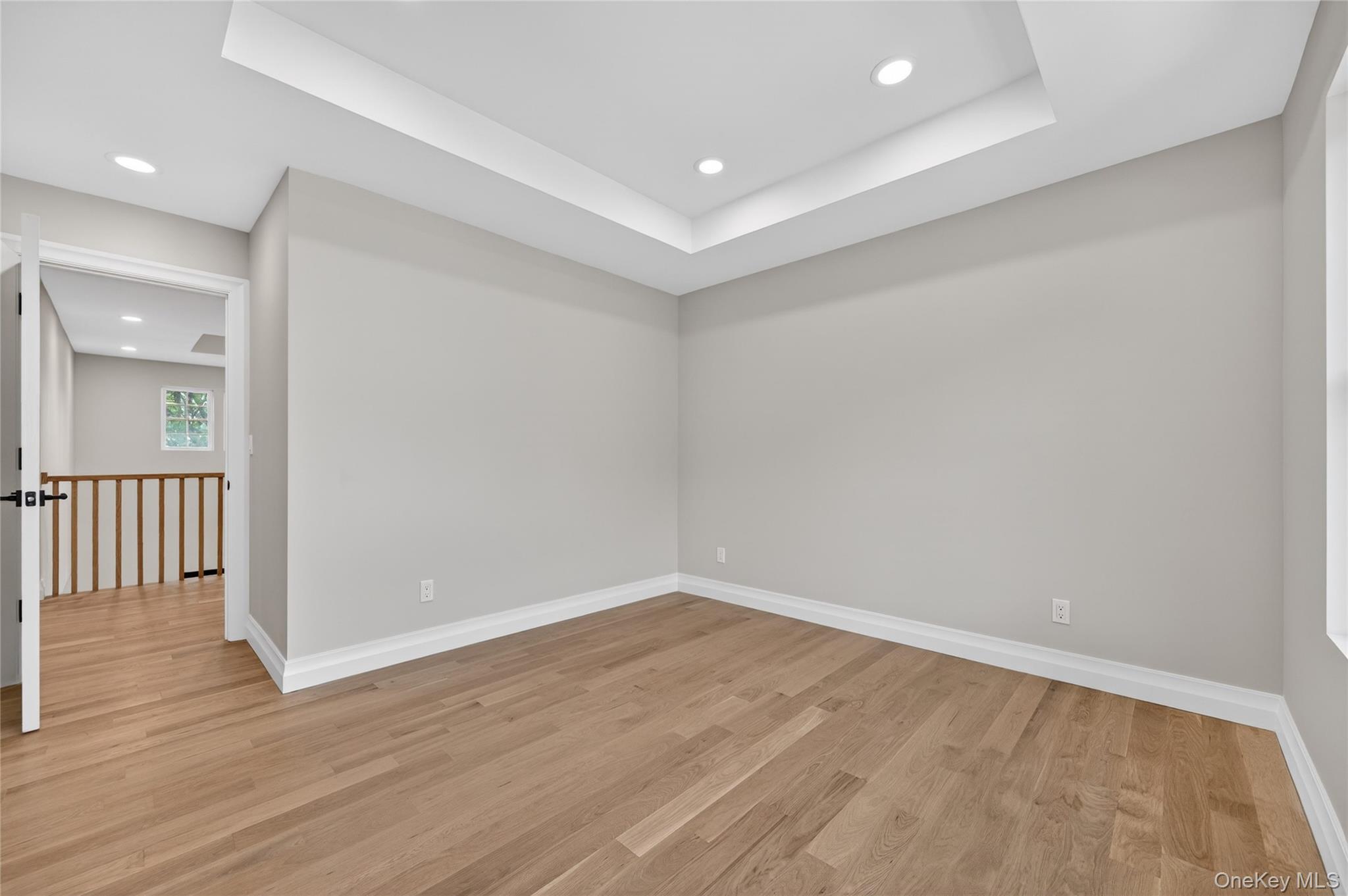 15 Ridge Drive Port Washington, NY 11050 - Photo 26 of 46 wooden floor in an empty room with a window