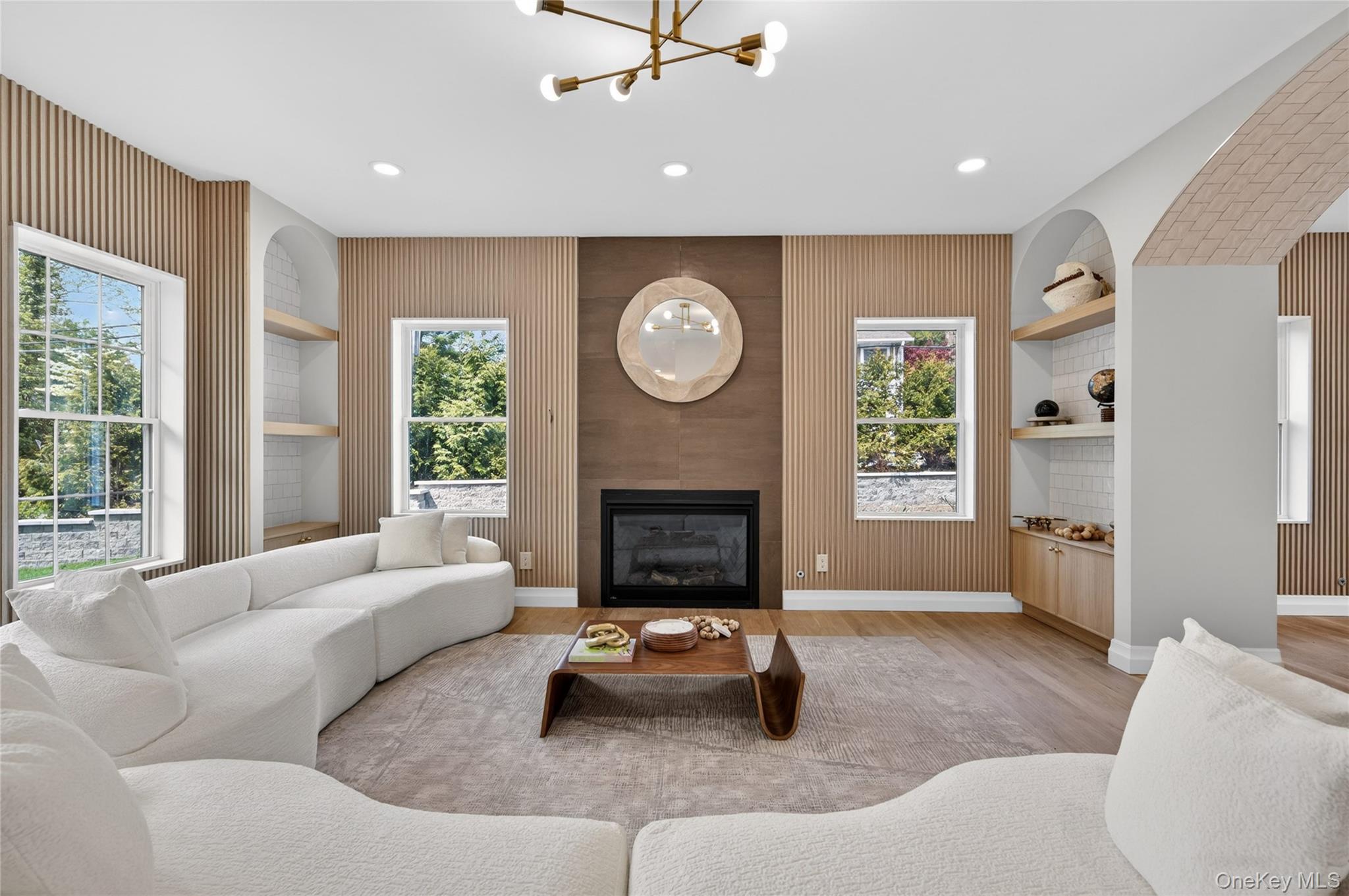 15 Ridge Drive Port Washington, NY 11050 - Photo 3 of 46 a living room with furniture and a fireplace