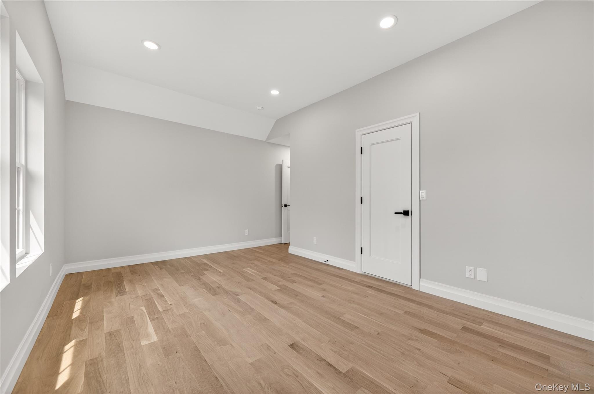15 Ridge Drive Port Washington, NY 11050 - Photo 33 of 46 wooden floor in an empty room with a window