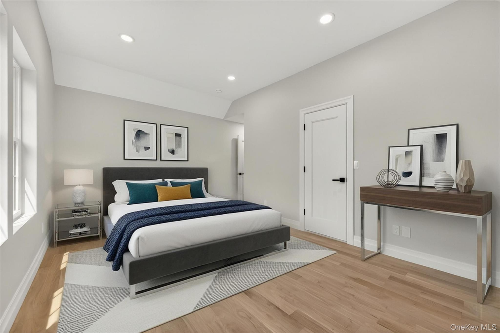 15 Ridge Drive Port Washington, NY 11050 - Photo 34 of 46 a bedroom with a bed and a painting