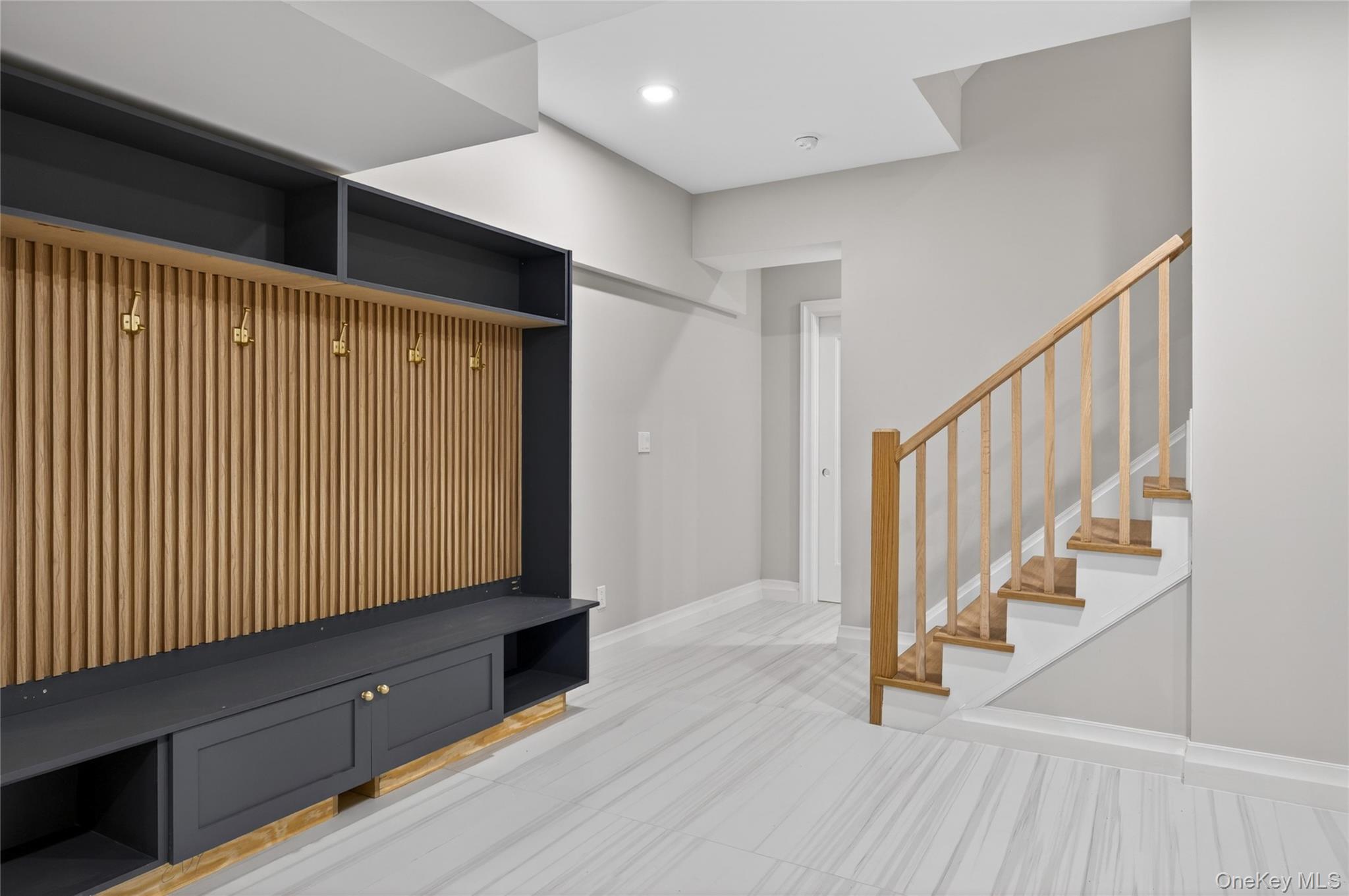 15 Ridge Drive Port Washington, NY 11050 - Photo 36 of 46 a view of entryway with wooden floor