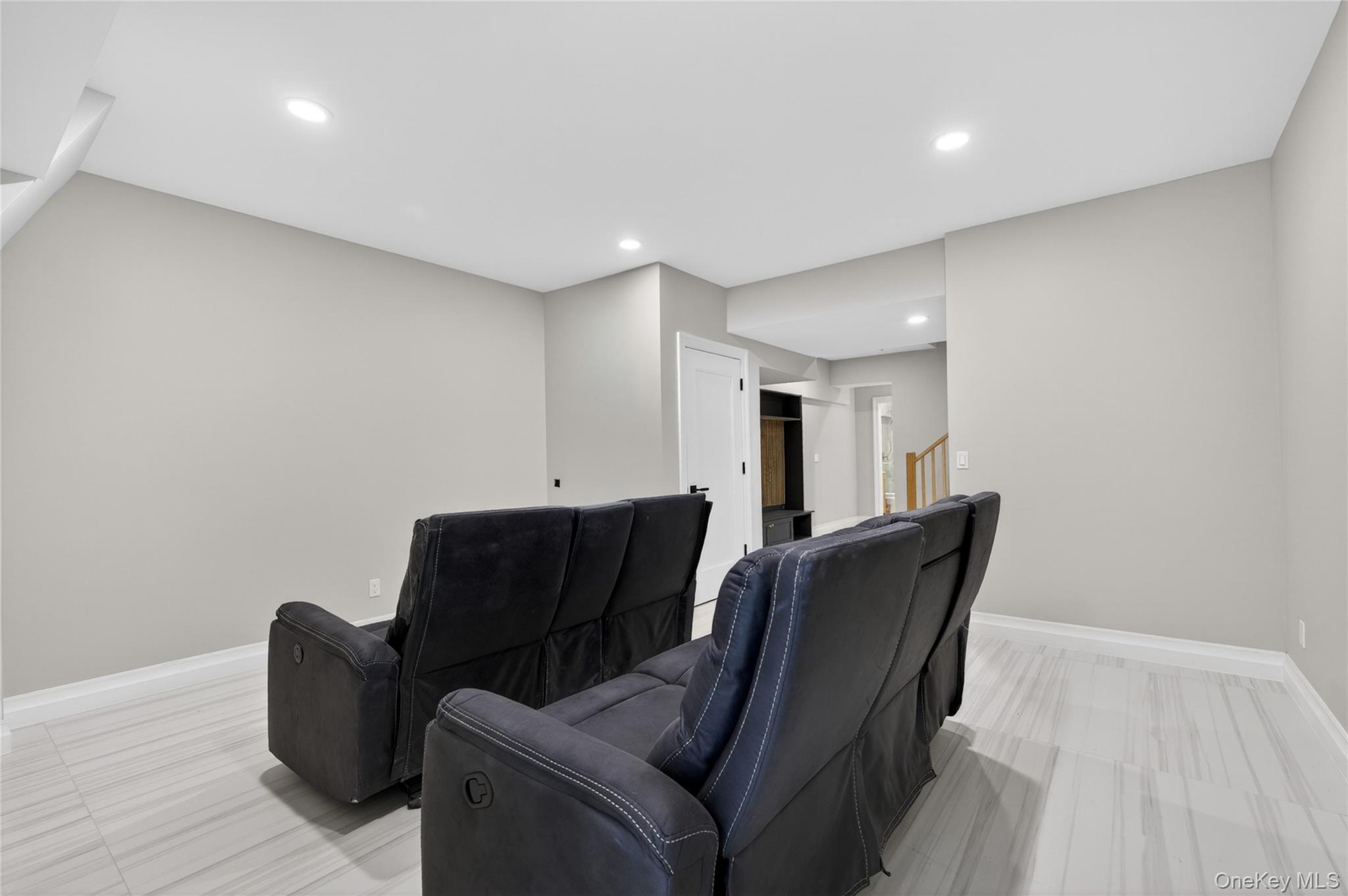 15 Ridge Drive Port Washington, NY 11050 - Photo 37 of 46 a living room with furniture and a wooden floor