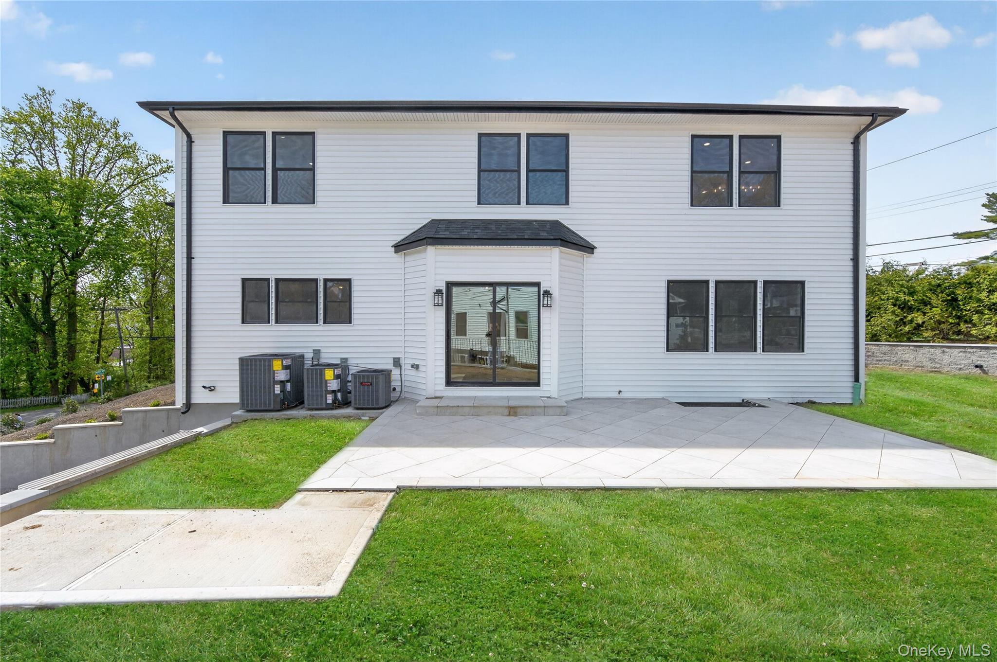 15 Ridge Drive Port Washington, NY 11050 - Photo 41 of 46 front view of a house with a yard