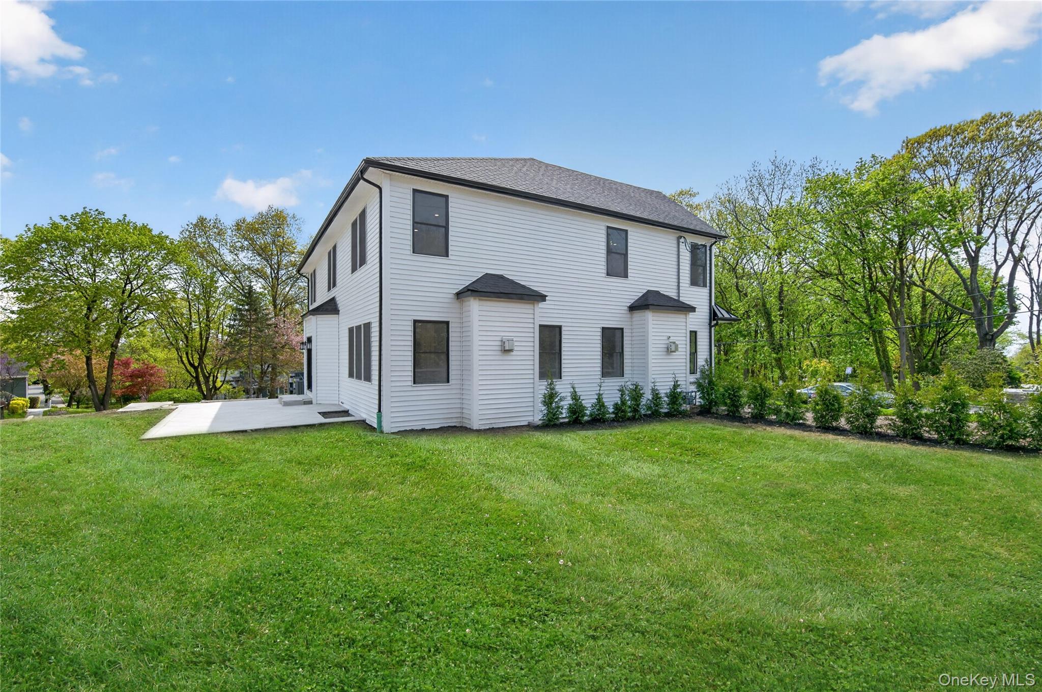 15 Ridge Drive Port Washington, NY 11050 - Photo 43 of 46 a view of a house with a big yard