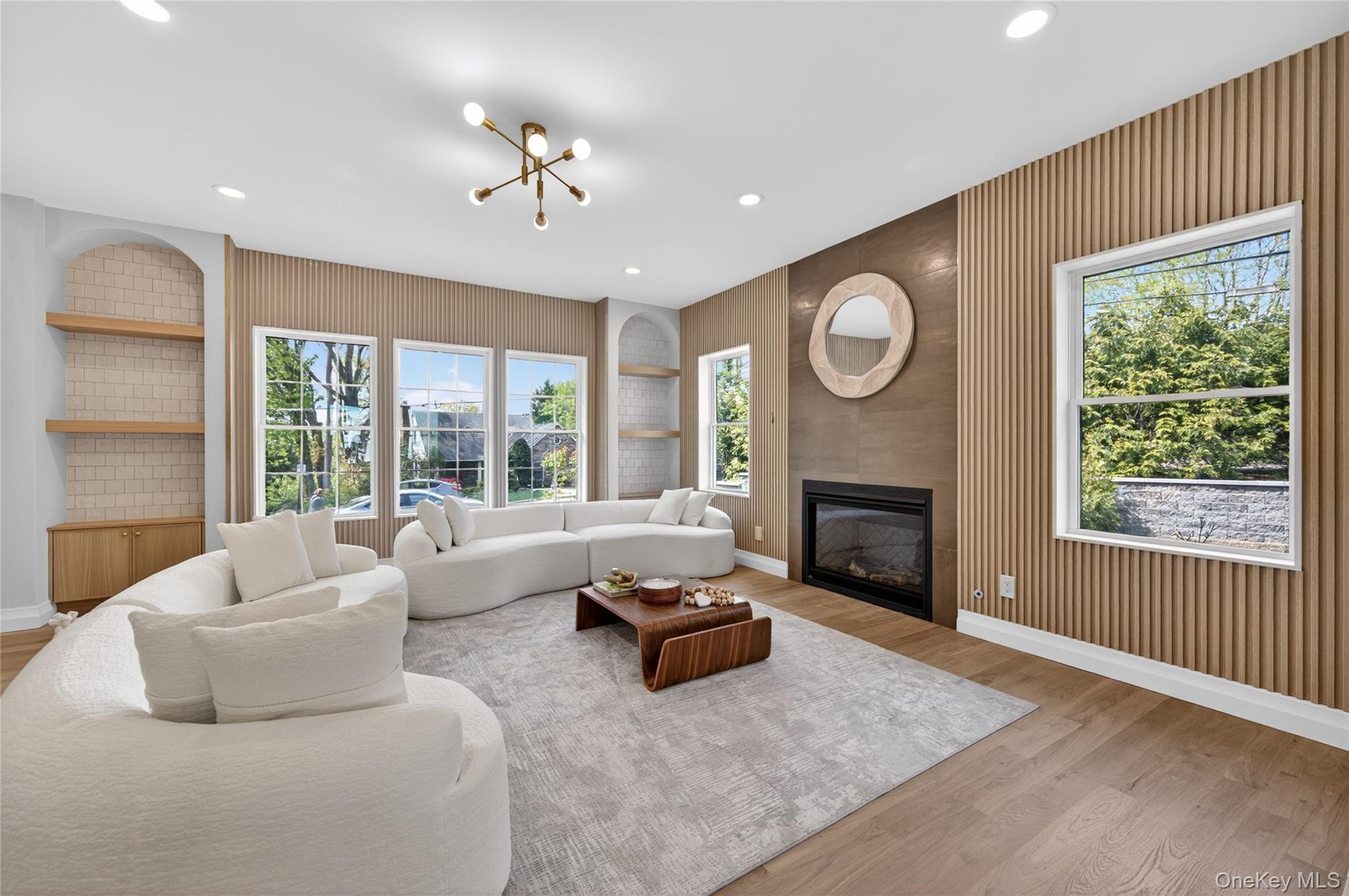 15 Ridge Drive Port Washington, NY 11050 - Photo 5 of 46 a living room with furniture and a fireplace