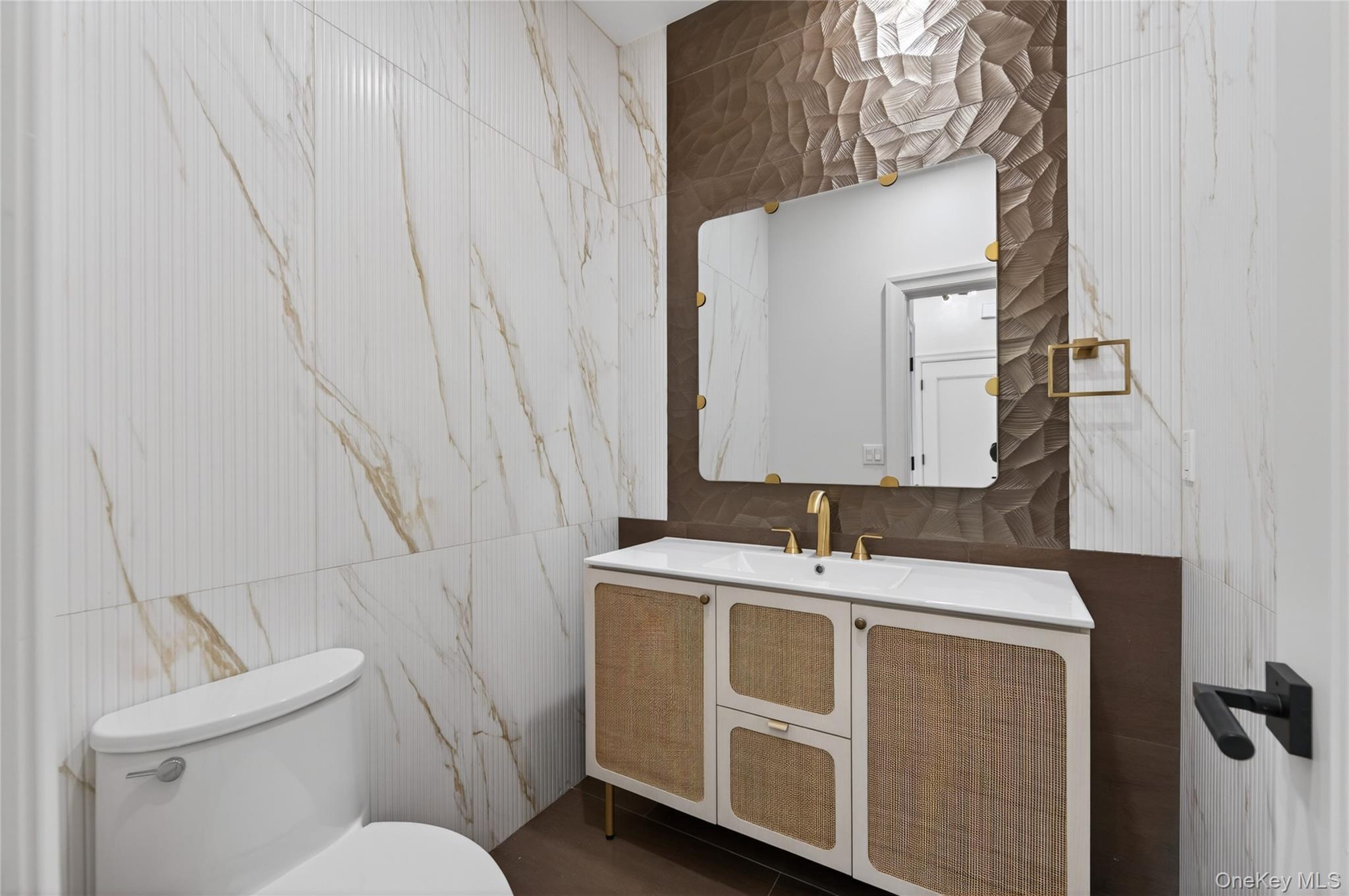 15 Ridge Drive Port Washington, NY 11050 - Photo 6 of 46 a bathroom with a sink and a mirror