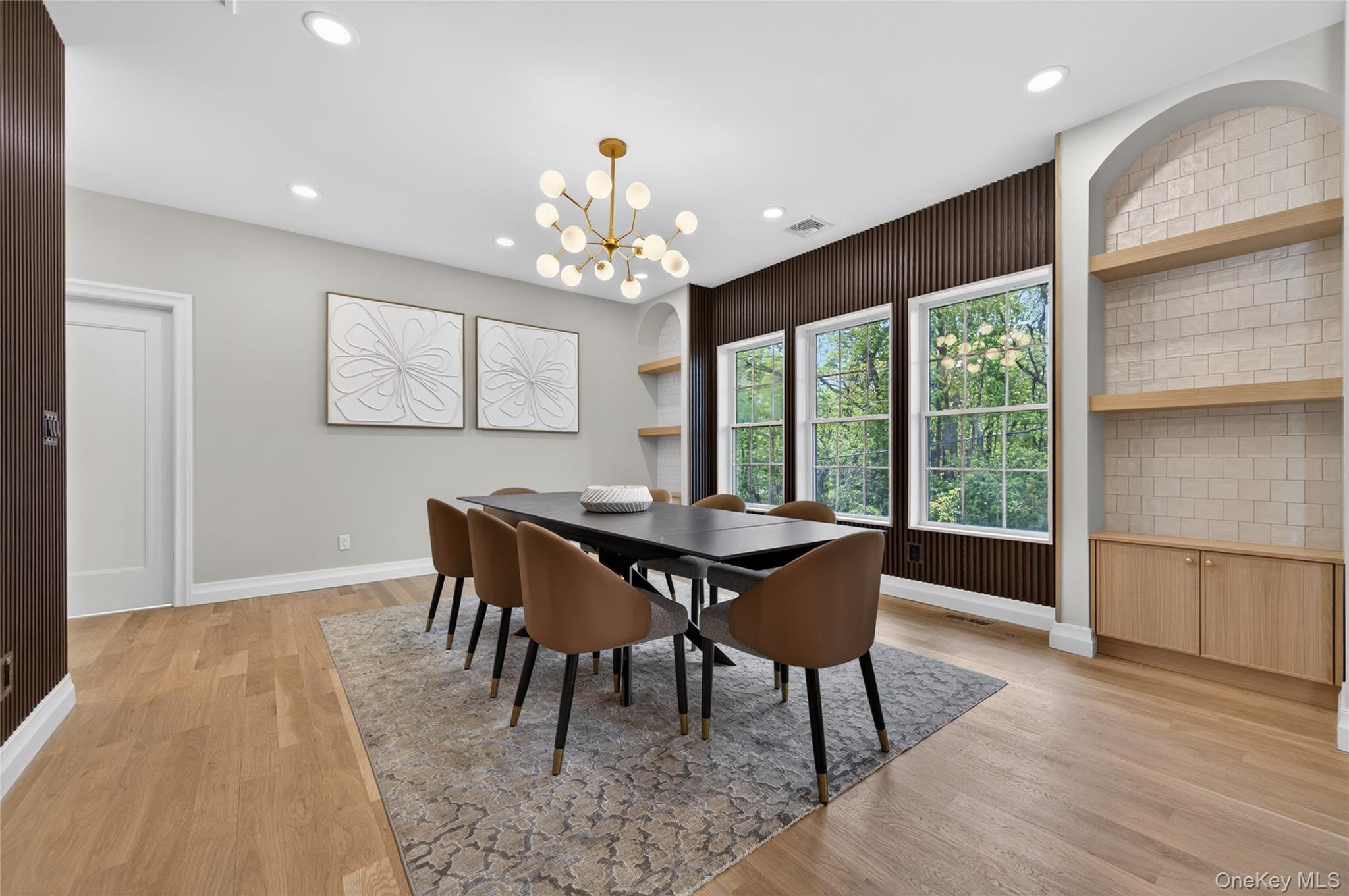 15 Ridge Drive Port Washington, NY 11050 - Photo 8 of 46 a view of a dining room with furniture window and wooden floor