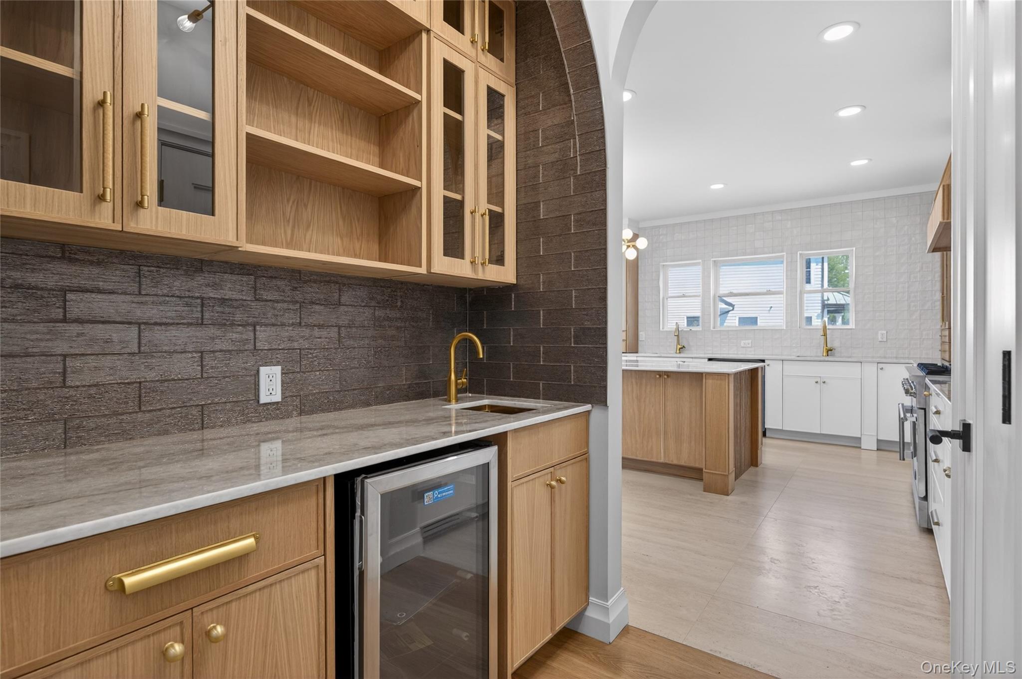 15 Ridge Drive Port Washington, NY 11050 - Photo 10 of 46 a kitchen that has a sink and a stove