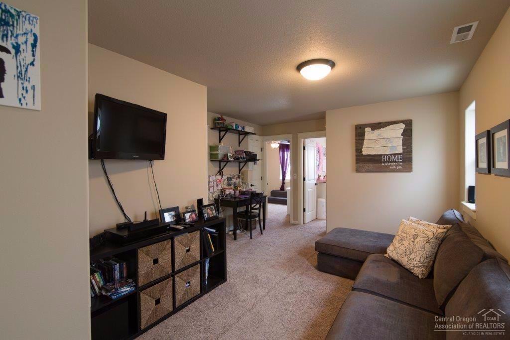 20244 Badger Road Bend, OR 97702 - Photo 11 of 25 The TV and TV mount stay
