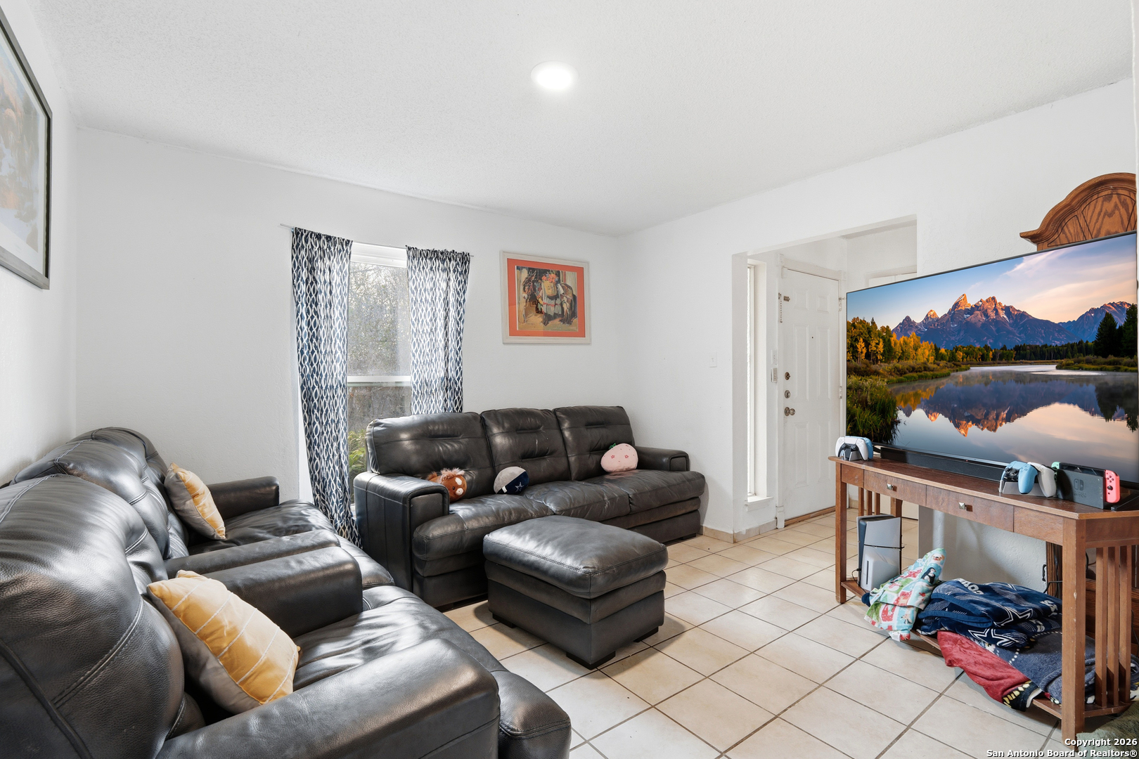 6113 Sun Dial Street Leon Valley, TX 78238 - Photo 7 of 21 a living room with furniture and a fireplace