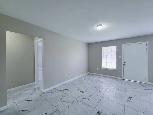 a view of an empty room and window