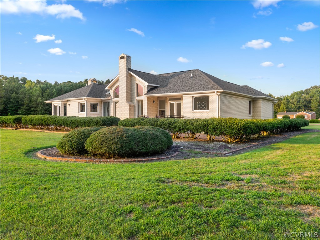 3906 Sharps Road Warsaw, VA 22572 - Photo 42 of 47 a front view of a house with yard and green space