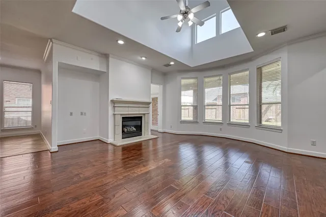 a view of a kitchen with a fireplace and wooden floor