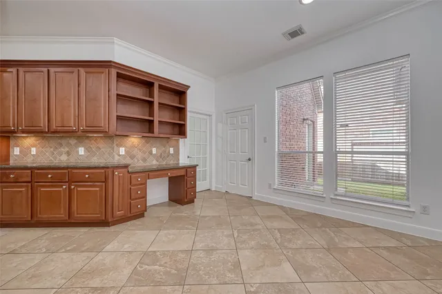 a open kitchen with stainless steel appliances kitchen island granite countertop a refrigerator and cabinets