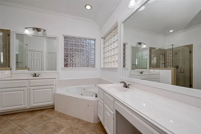 a bathroom with a bathtub shower and a sink