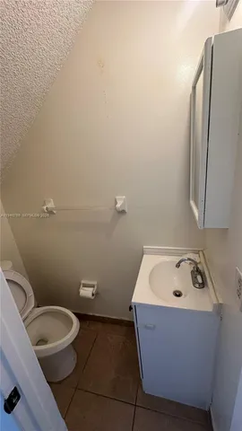 a bathroom with a toilet and a sink