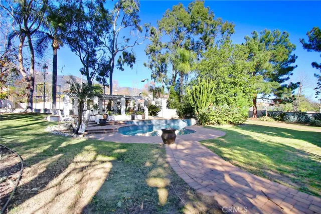 a view of a house with a patio and wooden flooring