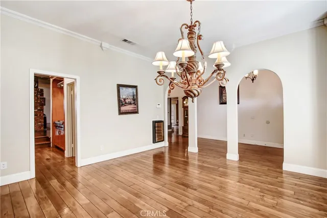 a view of a livingroom with wooden floor