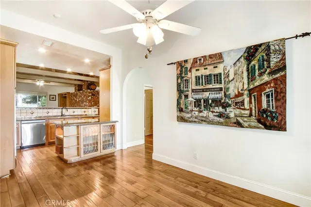 a kitchen with stainless steel appliances granite countertop a sink and cabinets