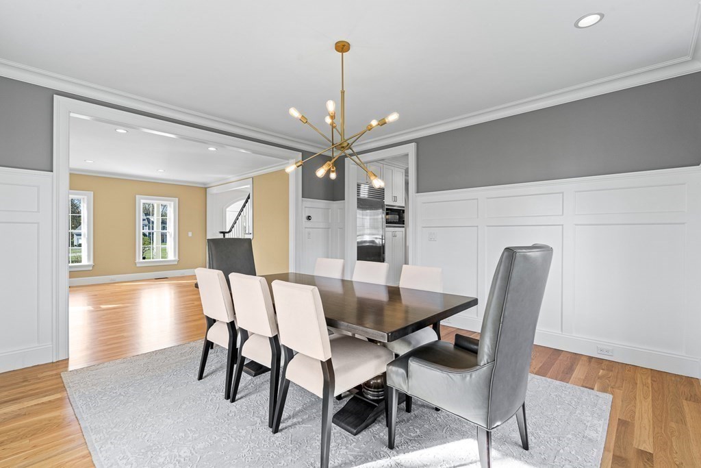 5 Cider Circle Bolton, MA 01740 - Photo 12 of 42 a view of a dining room with furniture and a chandelier