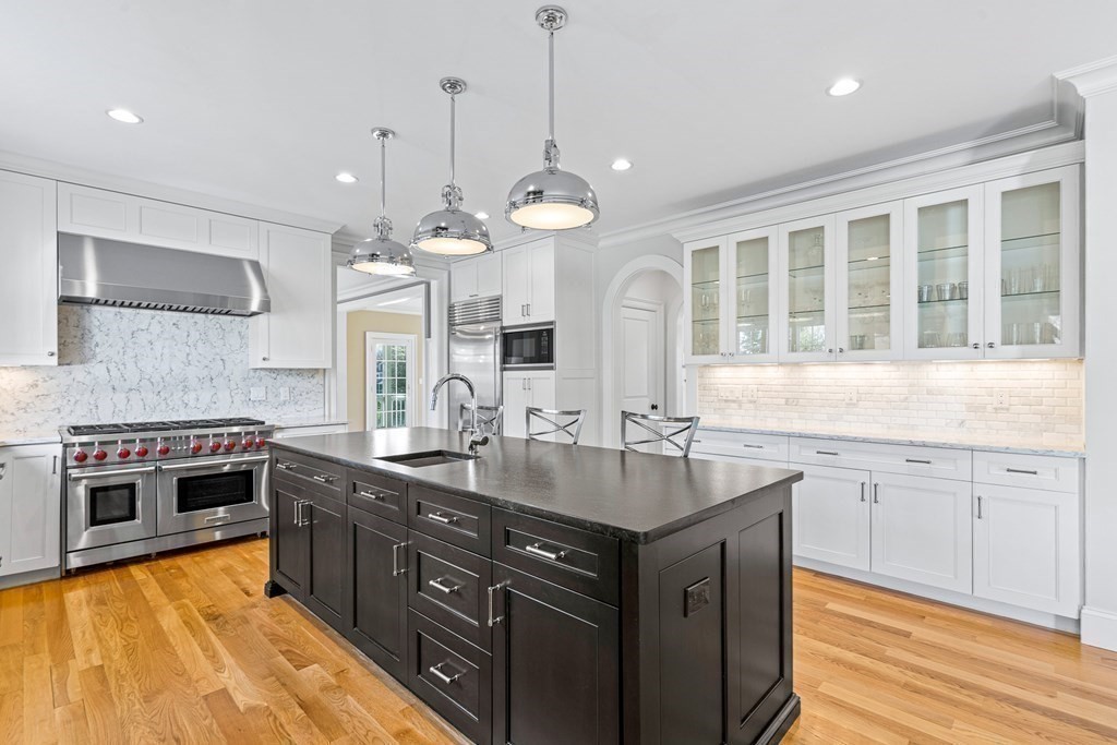 5 Cider Circle Bolton, MA 01740 - Photo 16 of 42 a kitchen with granite countertop cabinets stainless steel appliances a sink and a stove