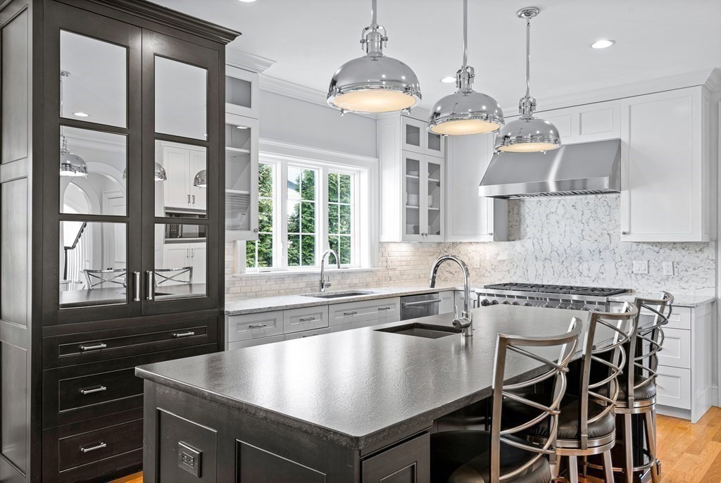 5 Cider Circle Bolton, MA 01740 - Photo 19 of 42 a kitchen with a table chairs and window