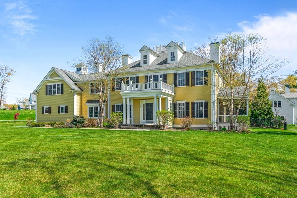 5 Cider Circle Bolton, MA 01740 - Photo 2 of 42 a front view of a building with a garden