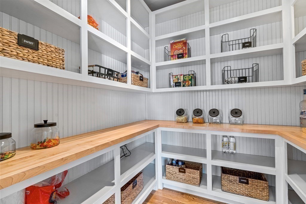 5 Cider Circle Bolton, MA 01740 - Photo 22 of 42 a shelf with books and knick knacks on it