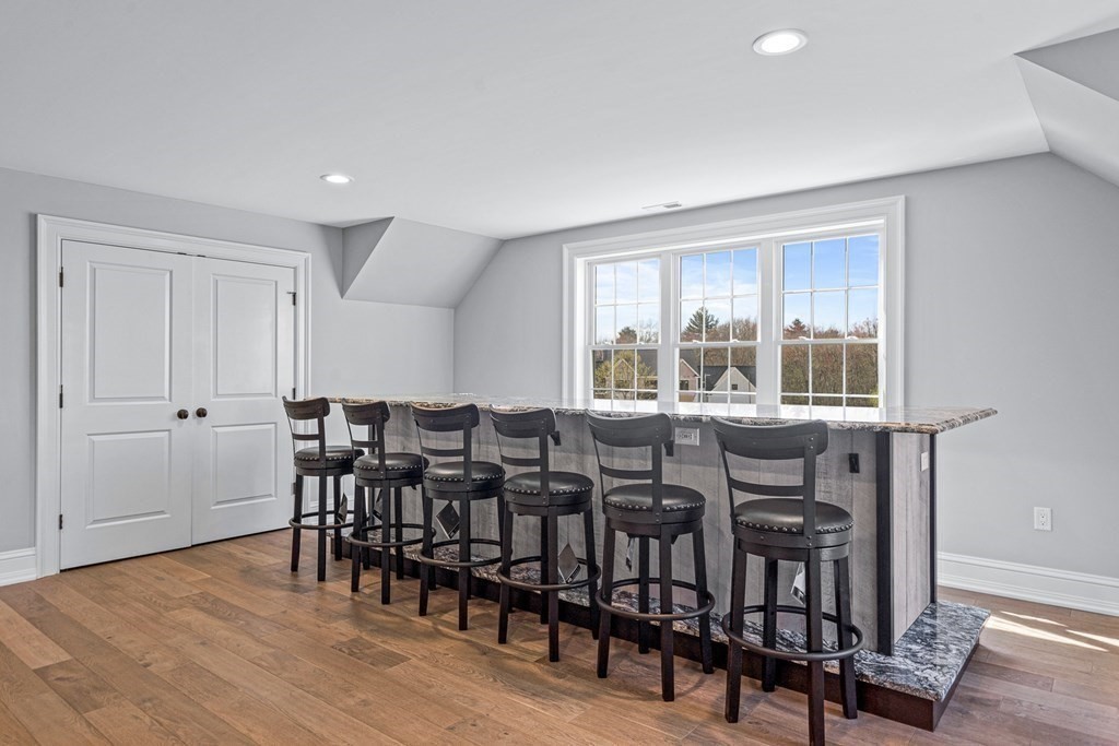 5 Cider Circle Bolton, MA 01740 - Photo 26 of 42 a view of a dining room with furniture and wooden floor