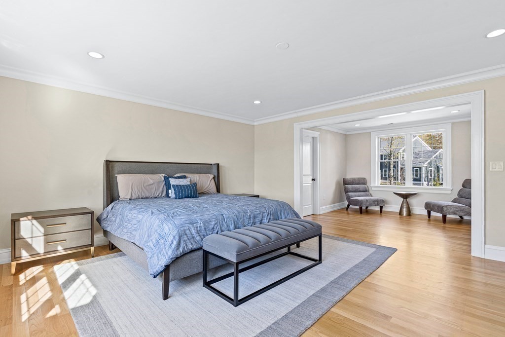 5 Cider Circle Bolton, MA 01740 - Photo 31 of 42 a spacious bedroom with a bed a table and a couch