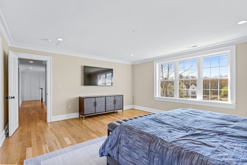 5 Cider Circle Bolton, MA 01740 - Photo 32 of 42 a bedroom with a bed and a flat screen tv