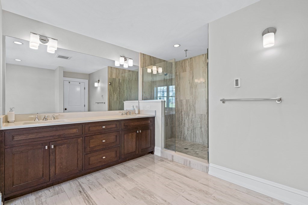 5 Cider Circle Bolton, MA 01740 - Photo 37 of 42 a spacious bathroom with a granite countertop sink mirror and a shower