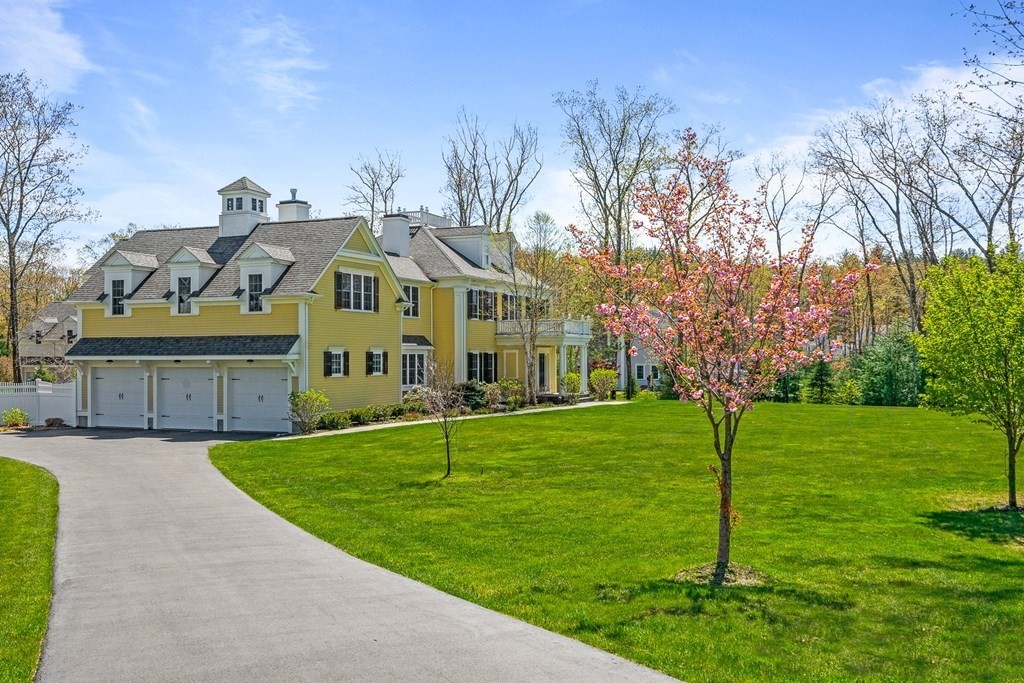 5 Cider Circle Bolton, MA 01740 - Photo 4 of 42 a view of a big house with a big yard and potted plants and large trees