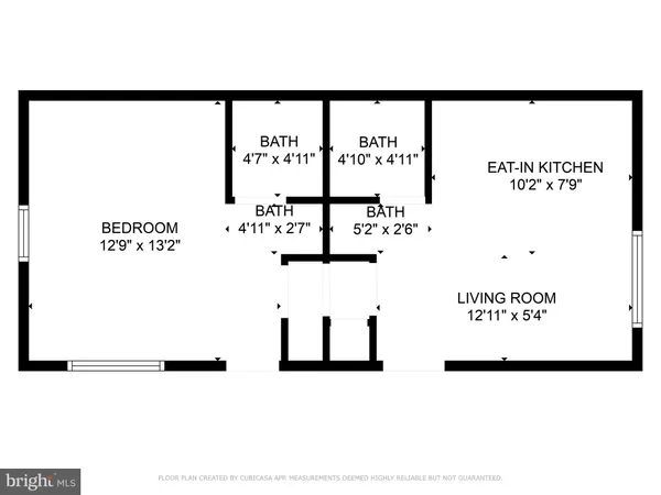 a picture of a bench in front of a window