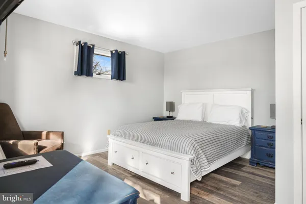 a bedroom with a bed and a couch