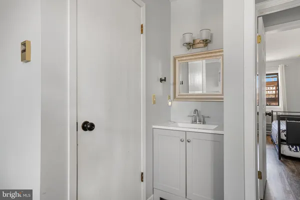 a en suite bathroom with a sink a mirror and shower