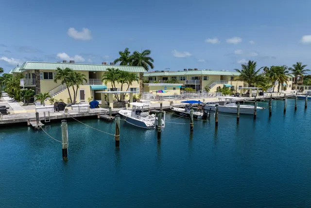 a view of a swimming pool with outdoor seating