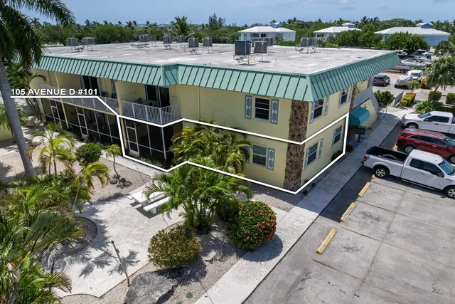 a view of a chairs and table in the balcony