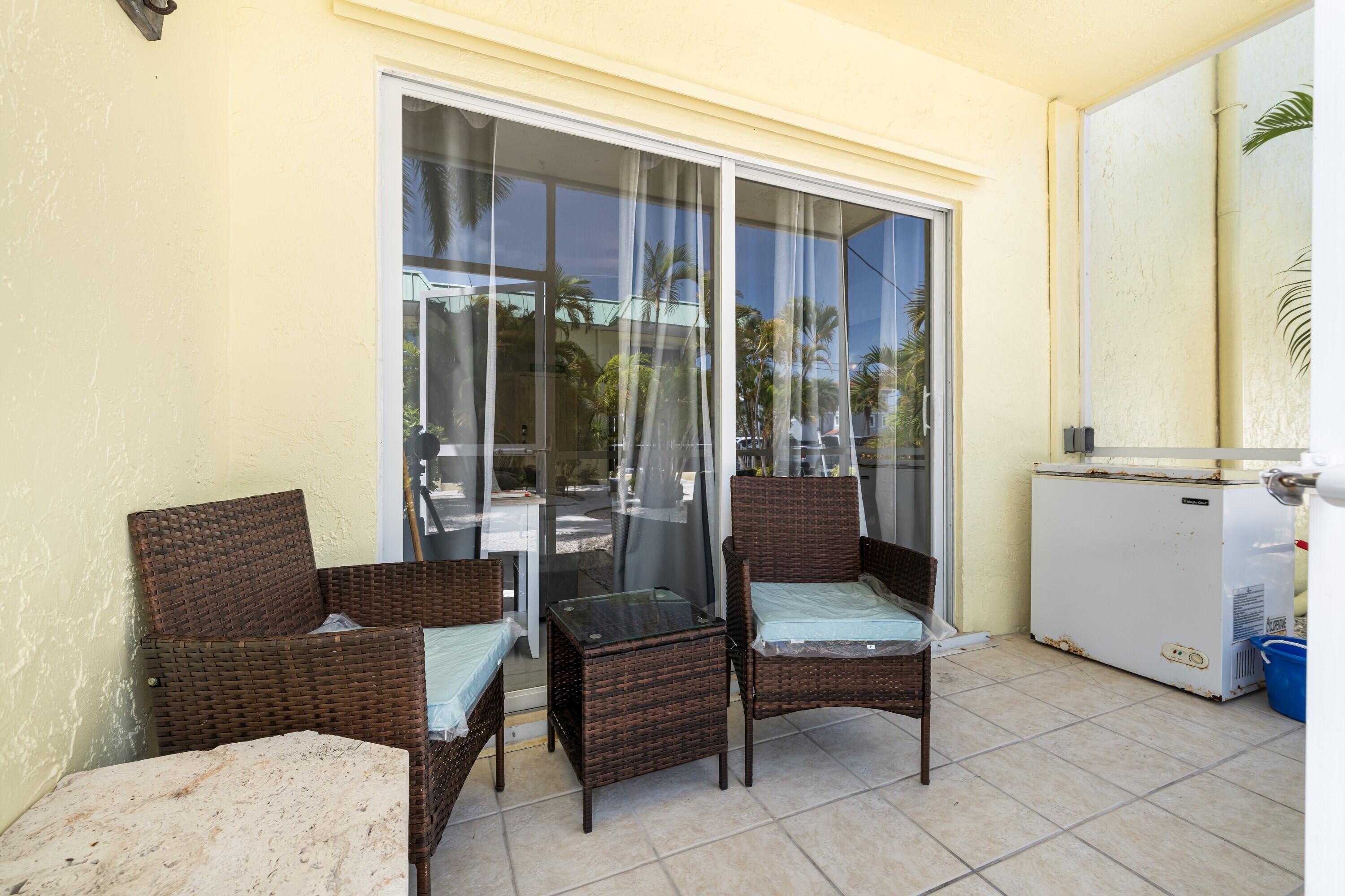105 Ave D, Unit 101 Marathon, FL 33050 - Photo 9 of 32 a living room with furniture and a window