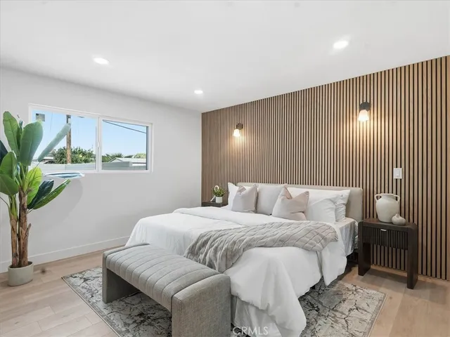 a bathroom with a sink and mirror with toilet