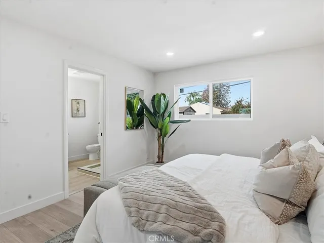 a bathroom with a toilet sink and shower