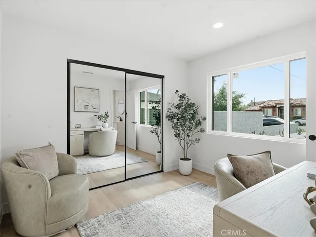 a dining room with furniture and wooden floor