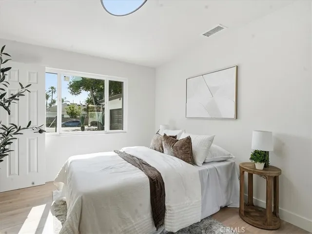 a view of a living room and floor to ceiling window