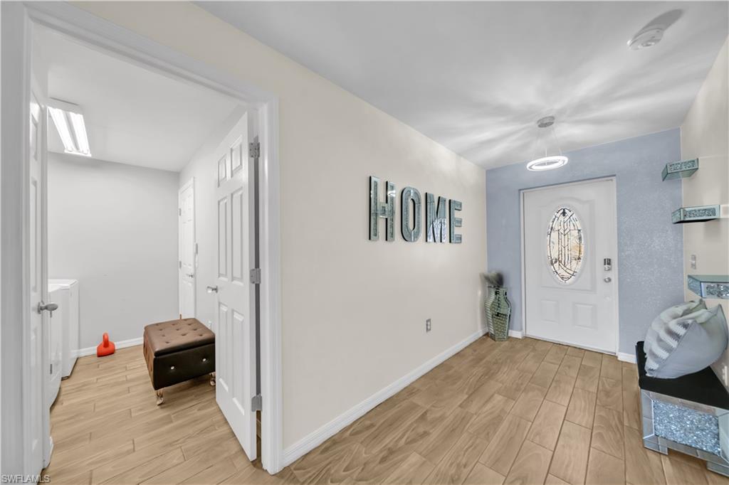 175 Shadowview Court Lehigh Acres, FL 33974 - Photo 14 of 39 a view of a livingroom with furniture and a ceiling fan