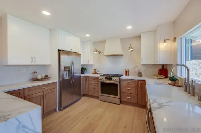 a kitchen with a sink cabinets and window