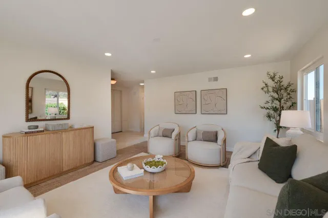 a large kitchen with a table and chairs
